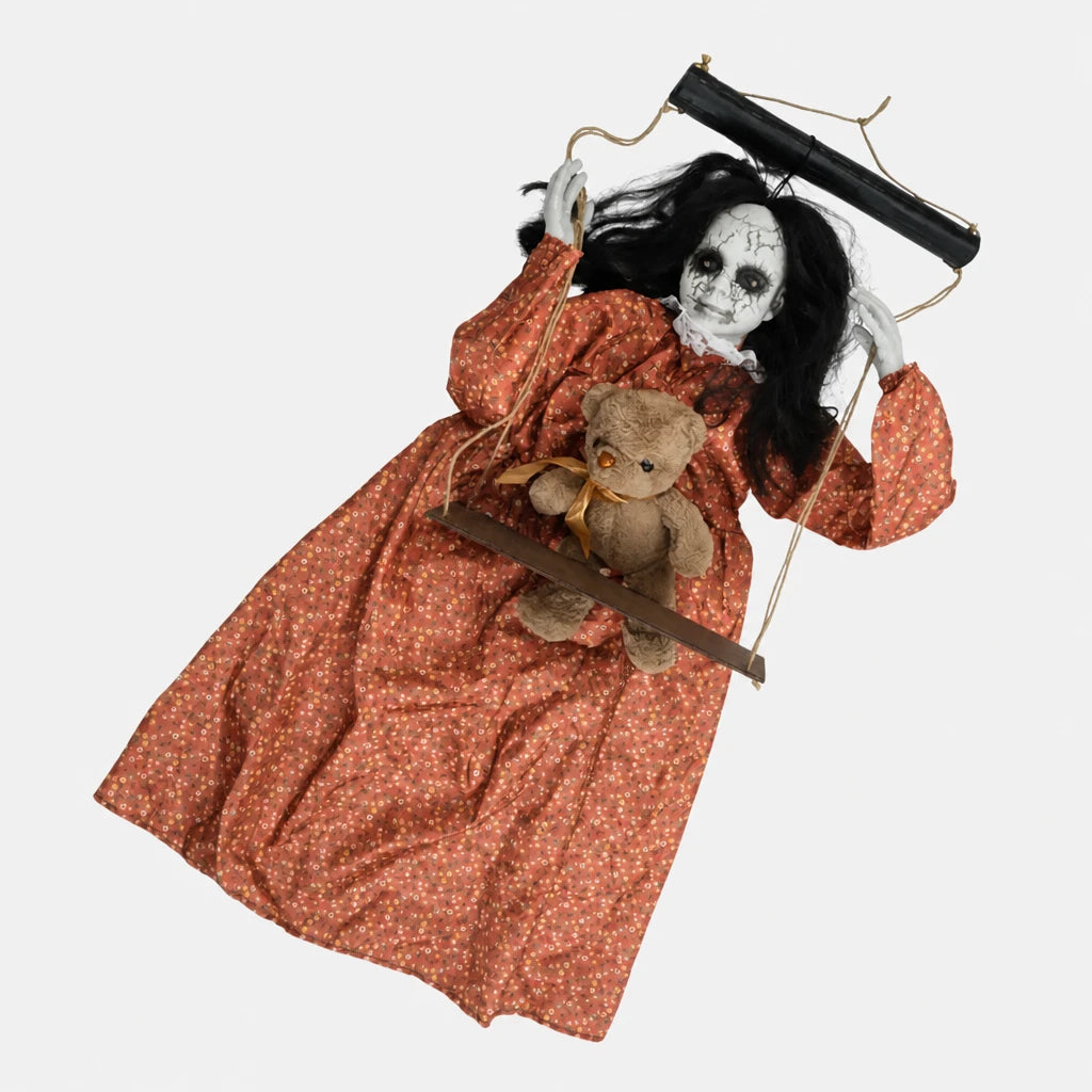 Skulke swinging ghost doll on its wooden swing holding a teddy bear on a plain studio background