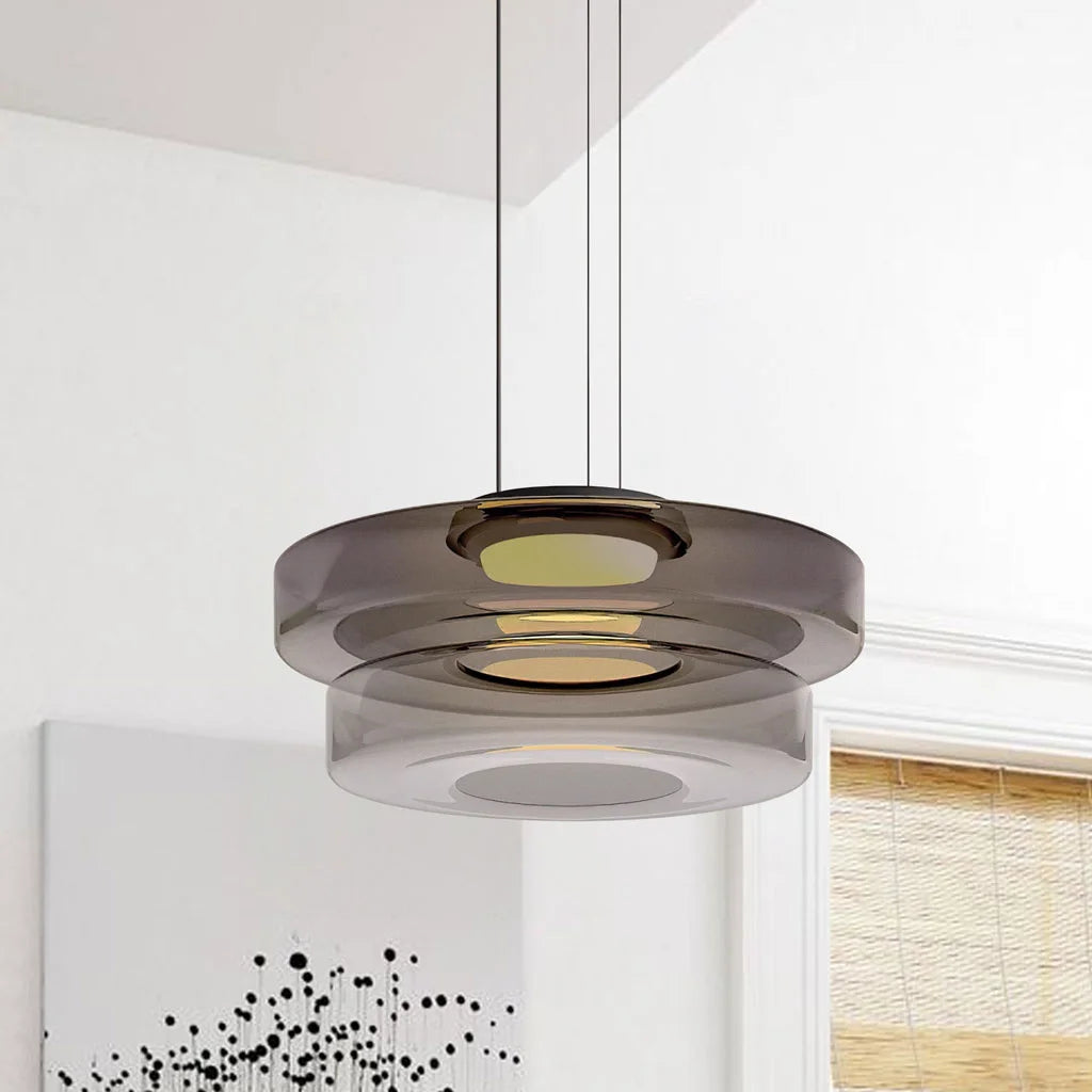 Smoke grey 2-layer glass ceiling light suspended against a minimalist interior wall