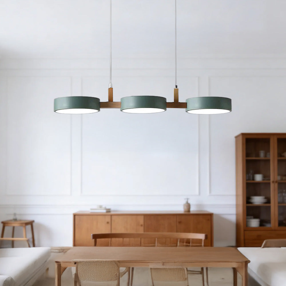 Solid green linear chandelier acting as an architectural focal point in a minimalist living space