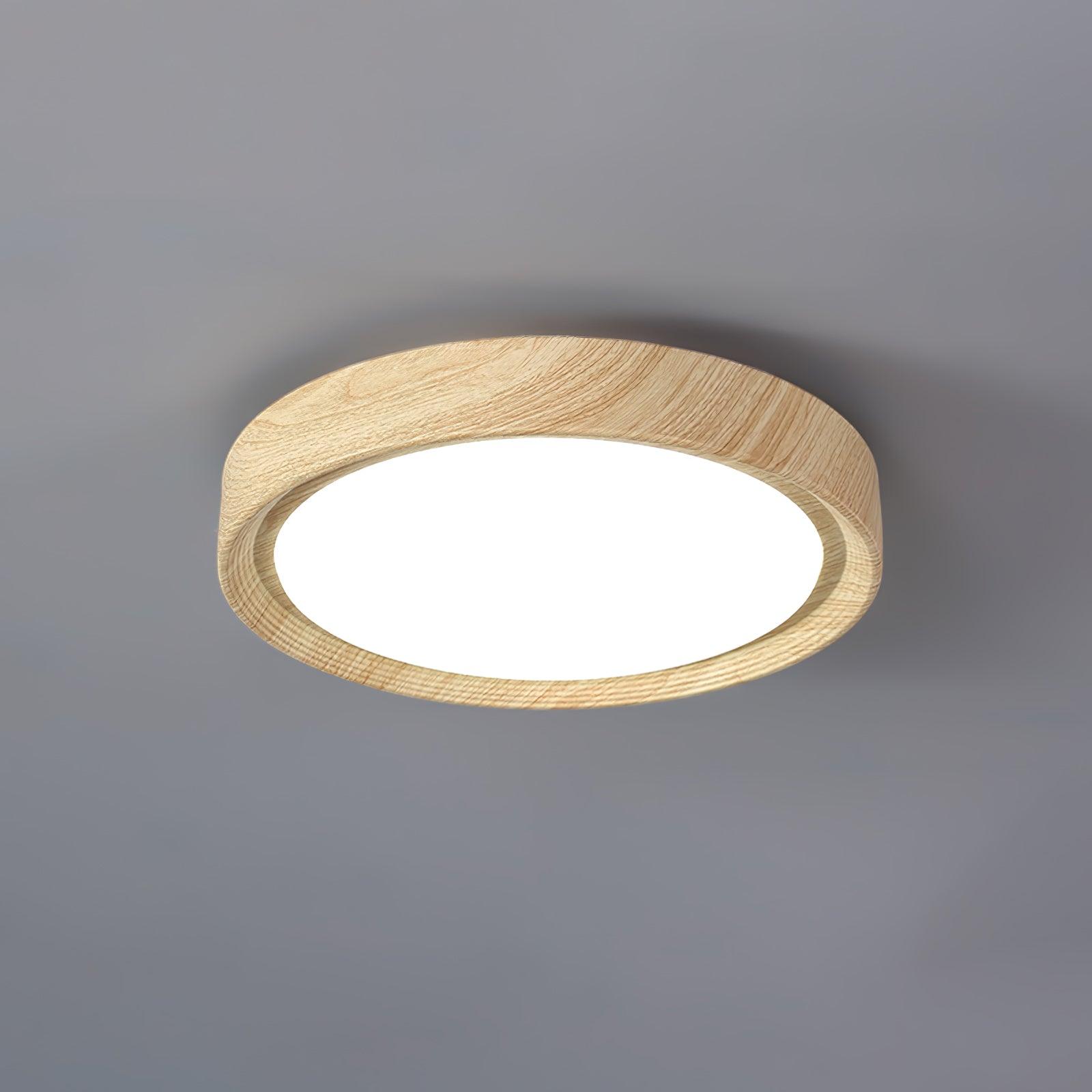 Straight edge light oak wood-effect ceiling lamp casting cool white light