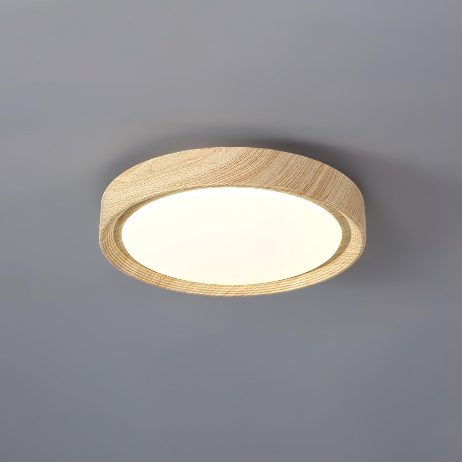 Angled view of the straight edge light oak wood-effect flush mount