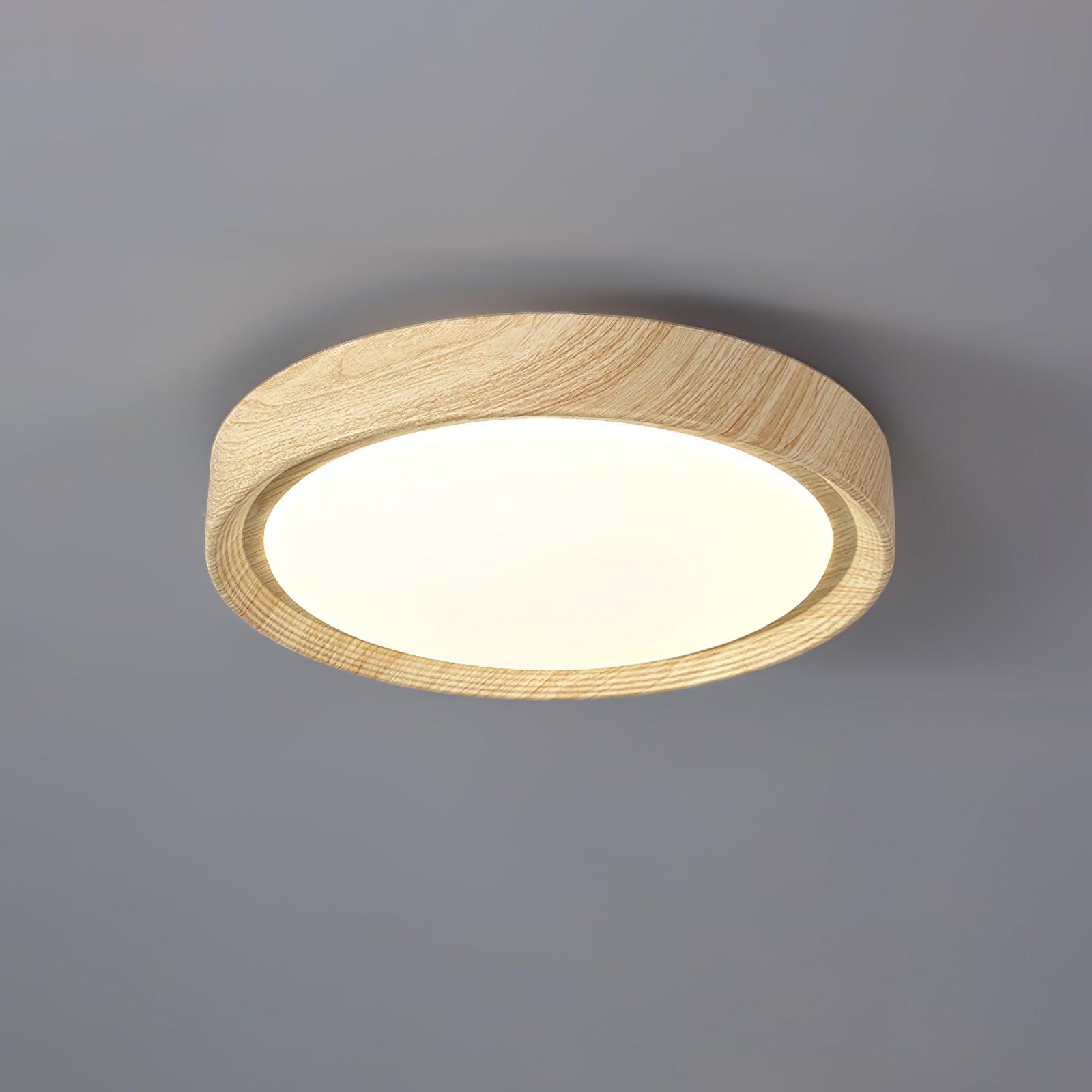 Straight edge light oak wood-effect flush mount casting warm white light
