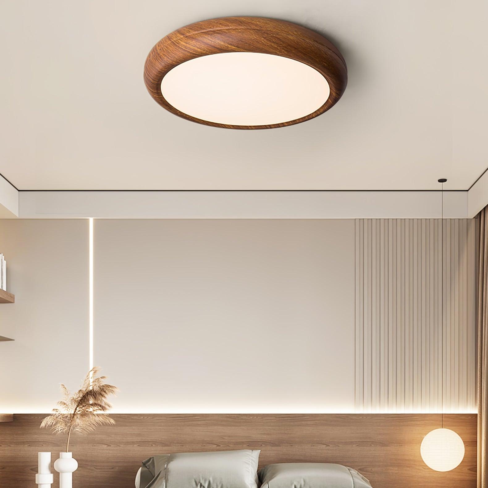 Straight profile walnut wood-style ceiling lamp in a minimalist bedroom