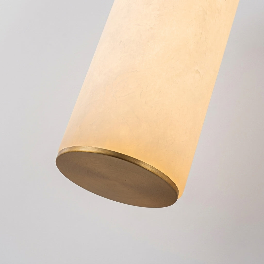 Close-up of Subxo Brass wall sconce marble tube glow