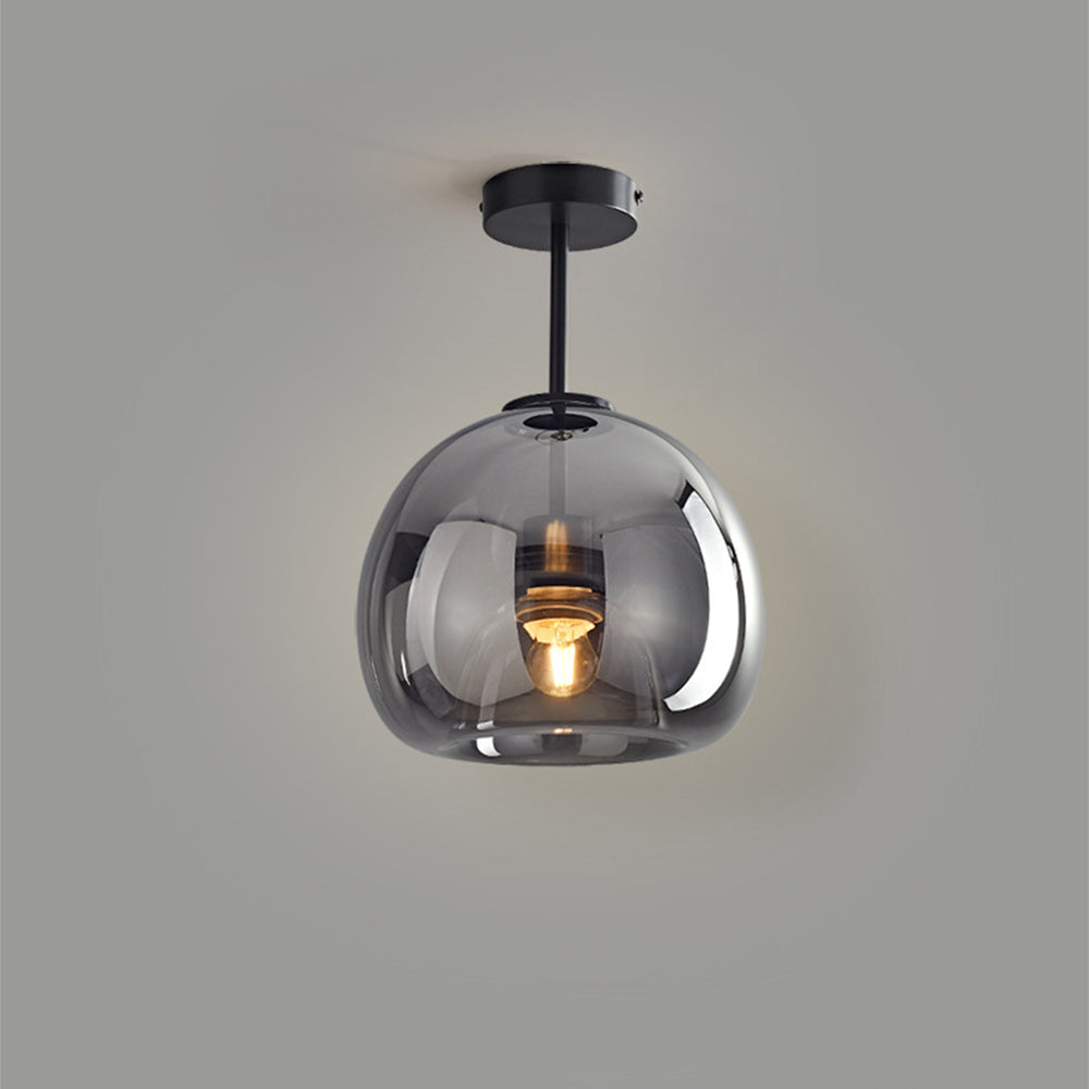 Isolated view of the tall black and smoke grey tinted glass ceiling lamp