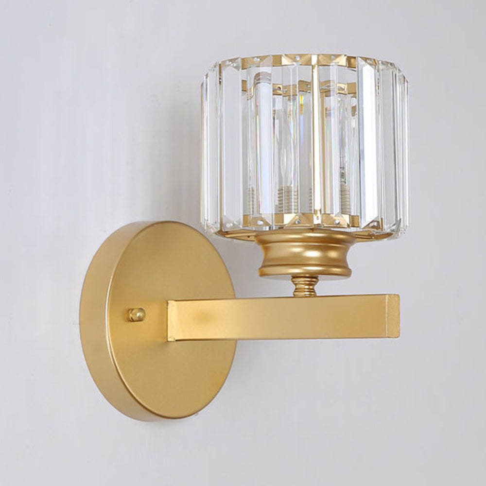 Isolated view of the elegant gold teja round crystal wall sconce with clear glass prisms