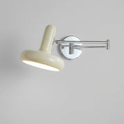 Tolzi cream swing arm wall sconce, illuminated, hero product shot