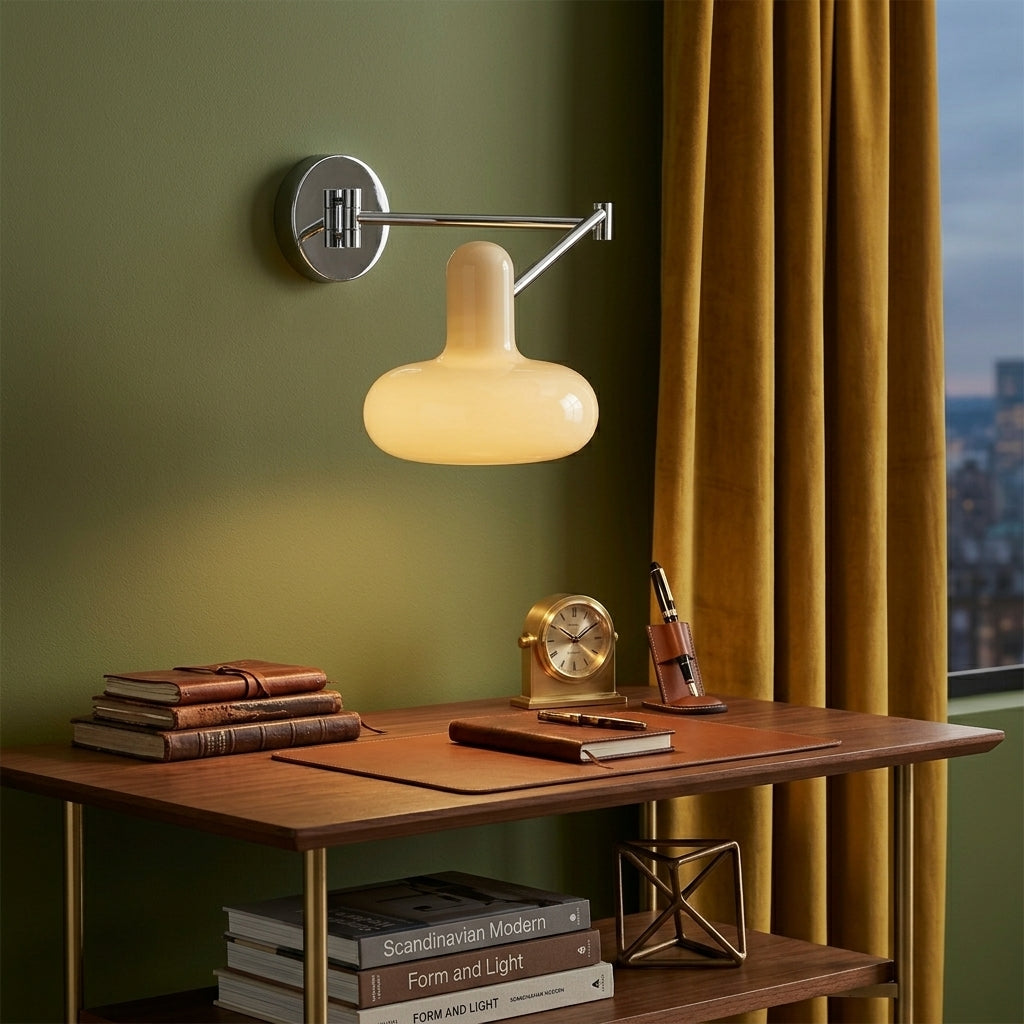 Tolzi cream wall sconce mounted above a desk beside a mustard curtain