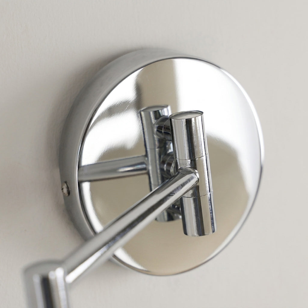 Tolzi wall sconce chrome wall plate and arm, close-up detail