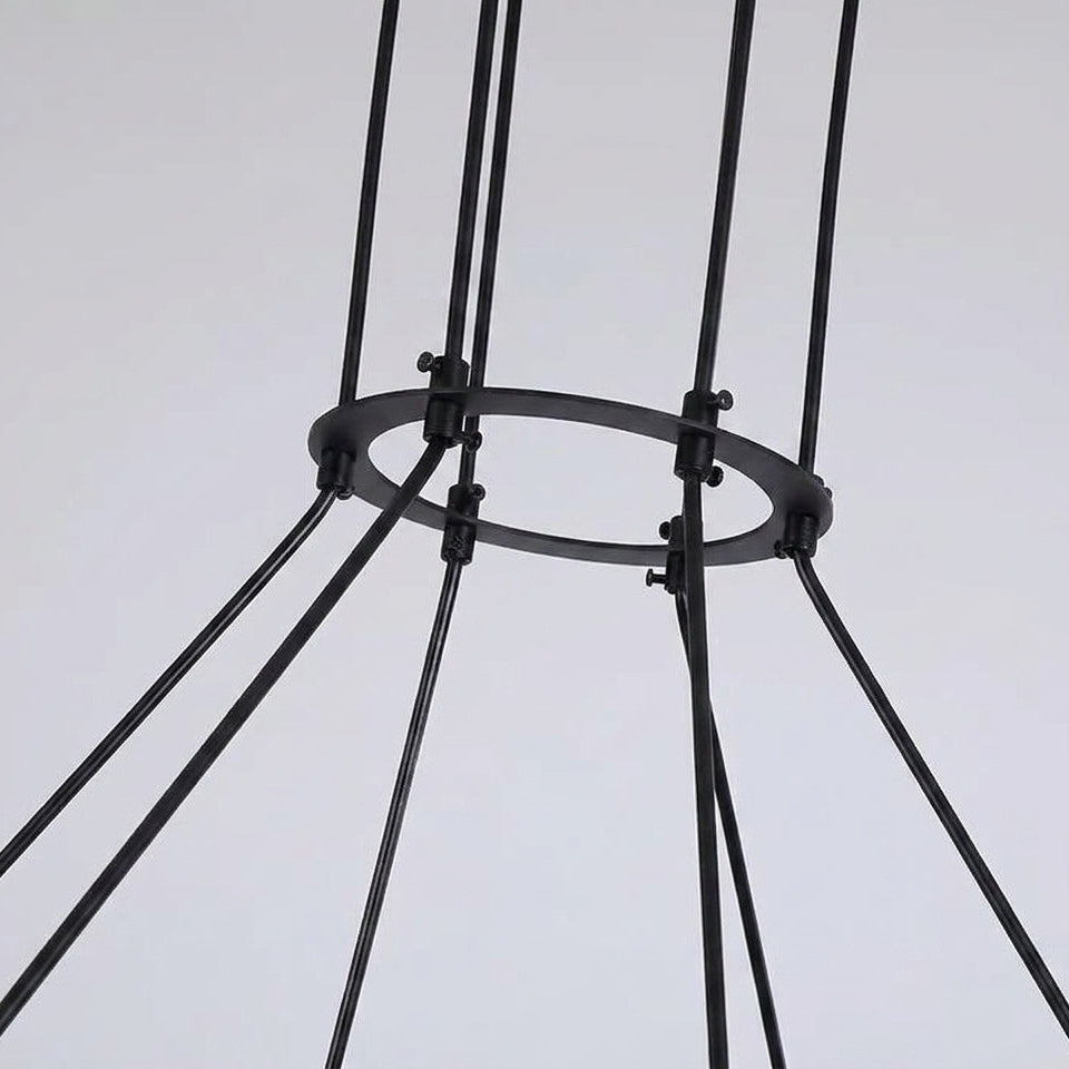 Close-up of the Tuntla chandelier's black ceiling canopy with adjustable suspension cables