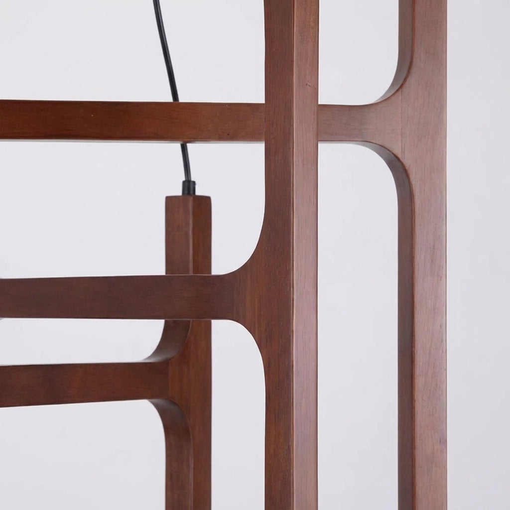 Close-up of the angular solid wood joinery on the Tuntla chandelier frame