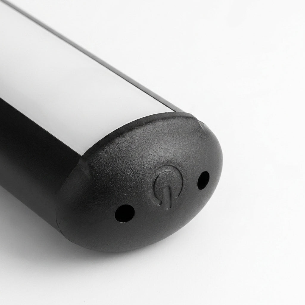 Side view close-up of the Tuvqi black picture light's end cap turn on switch