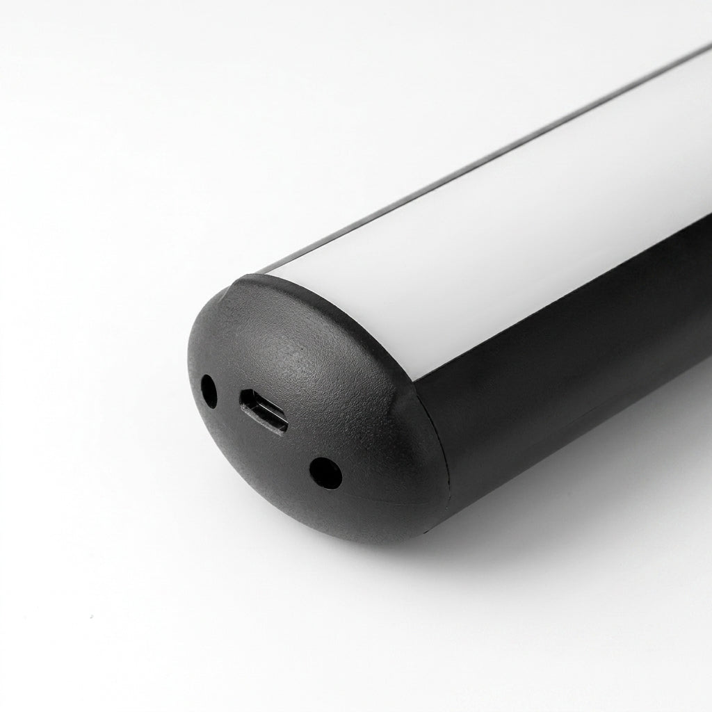 Close-up of the Tuvqi black picture light's end cap with usb-c charging port