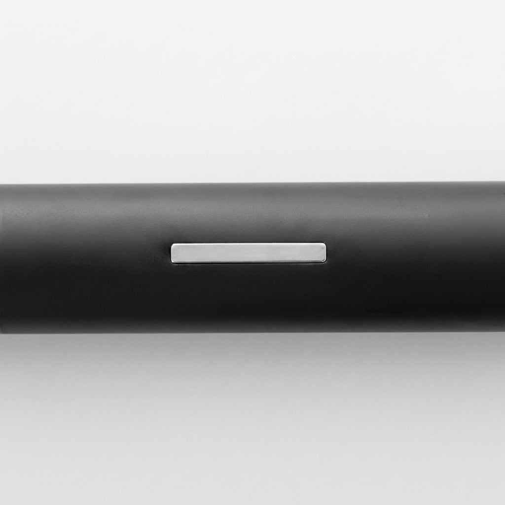 Close-up of the Tuvqi black tube body showing the magnet at the back