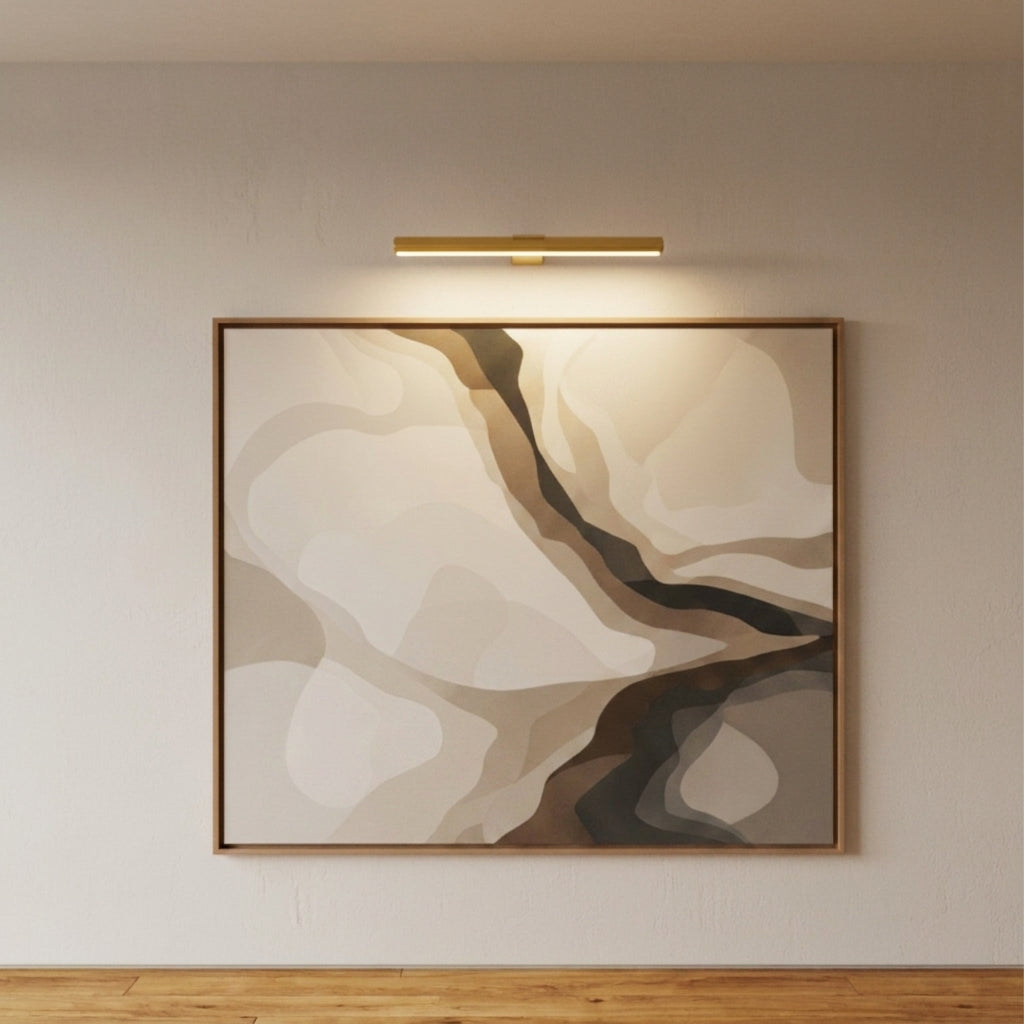 Close-up of Tuvqi gold picture light illuminating an abstract painting