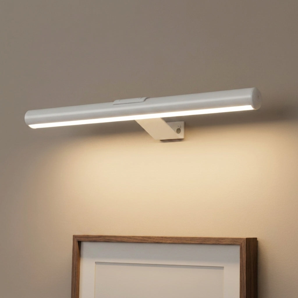 Tuvqi white wireless LED picture light mounted above framed art