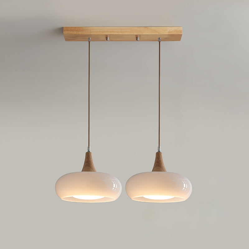 2-head white mid-century linear island light featuring a matching wooden ceiling plate