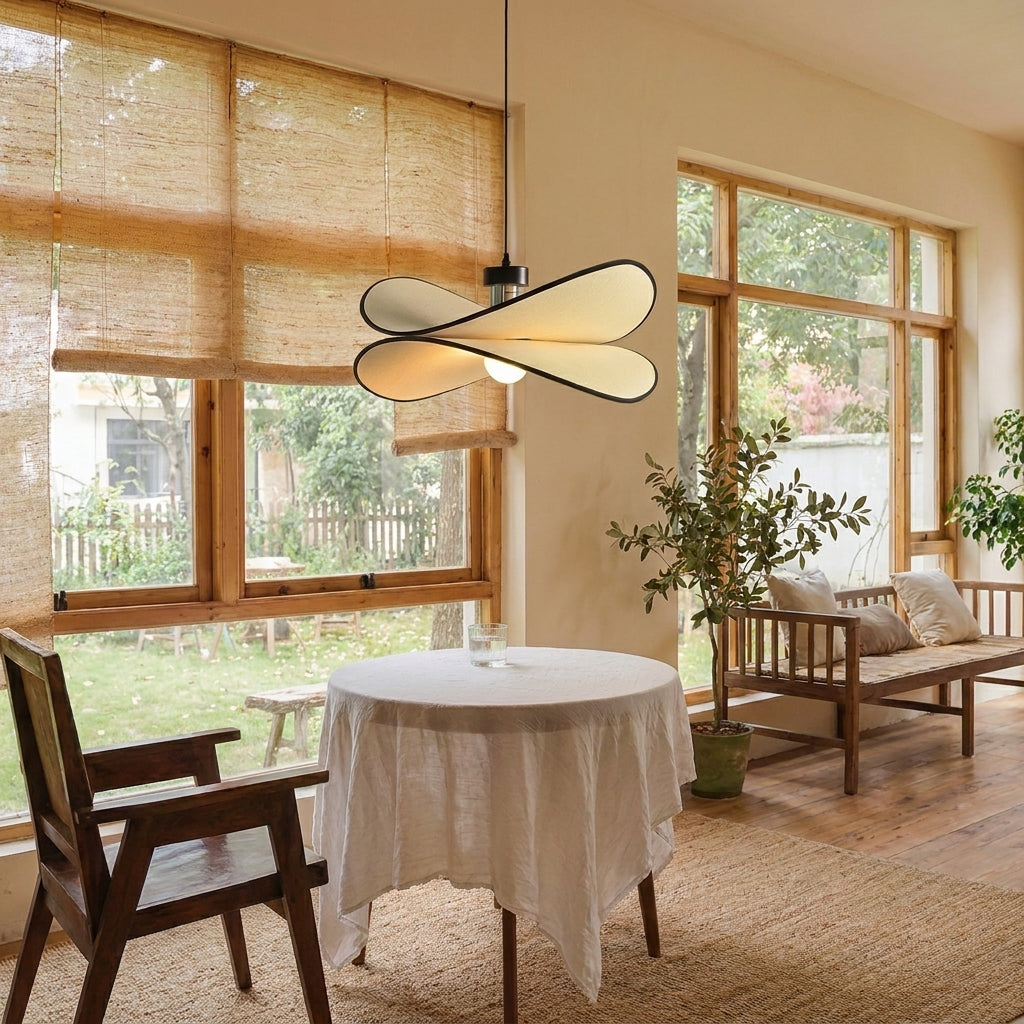 Ujnu dragonfly pendant light above a dining table by a window