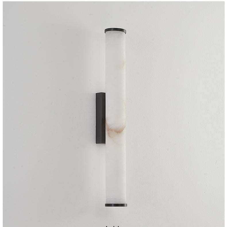 Unlit natural alabaster wall sconce with black hardware showcasing its authentic raw stone texture