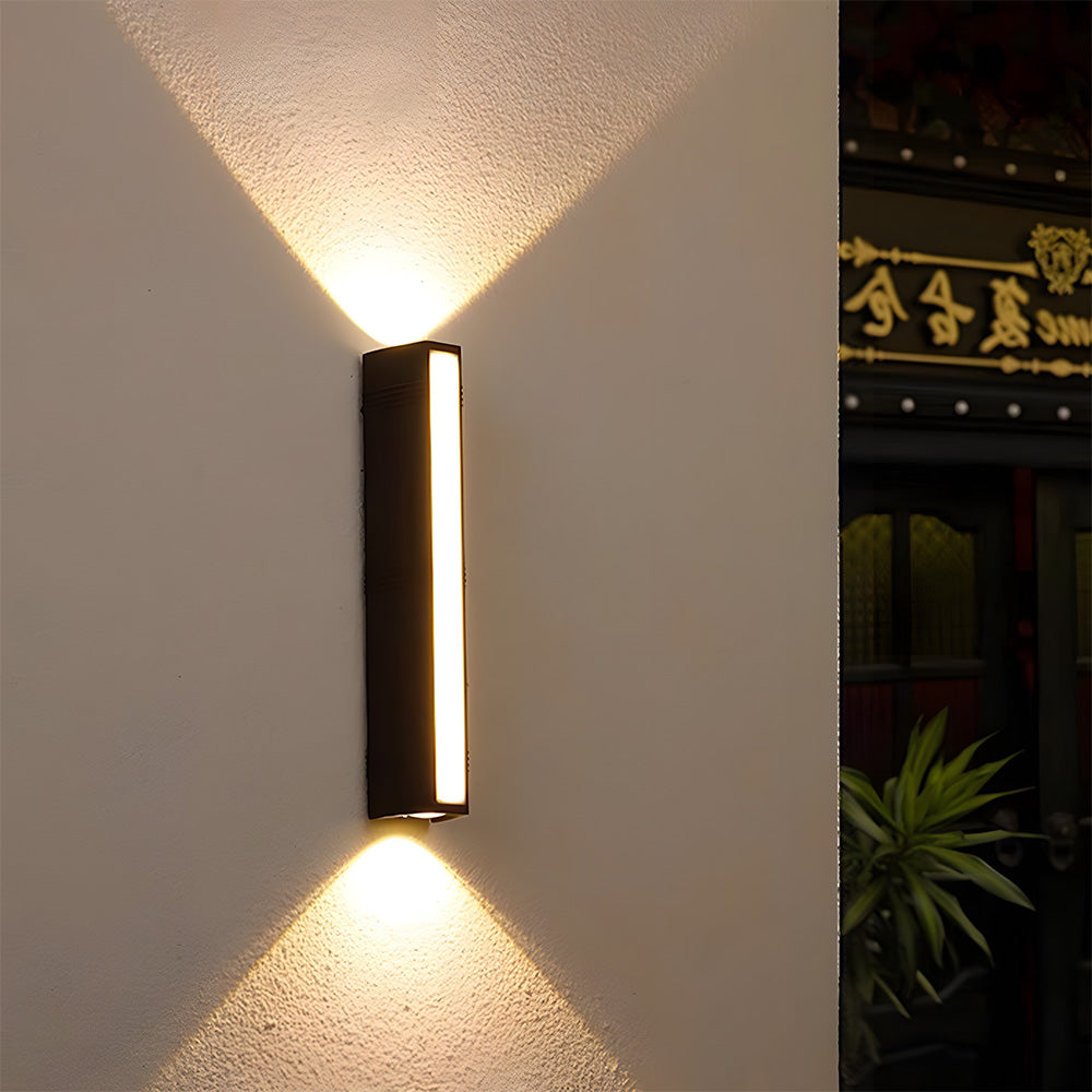 Detailed view of the dramatic up and down V-shaped light beam effect from the outdoor wall lamp