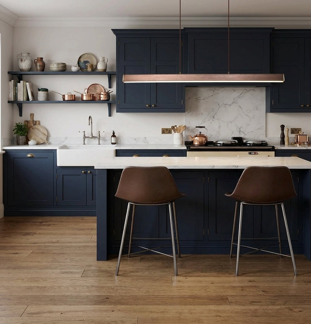 Uvza linear pendant light above a kitchen island with a farmhouse sink