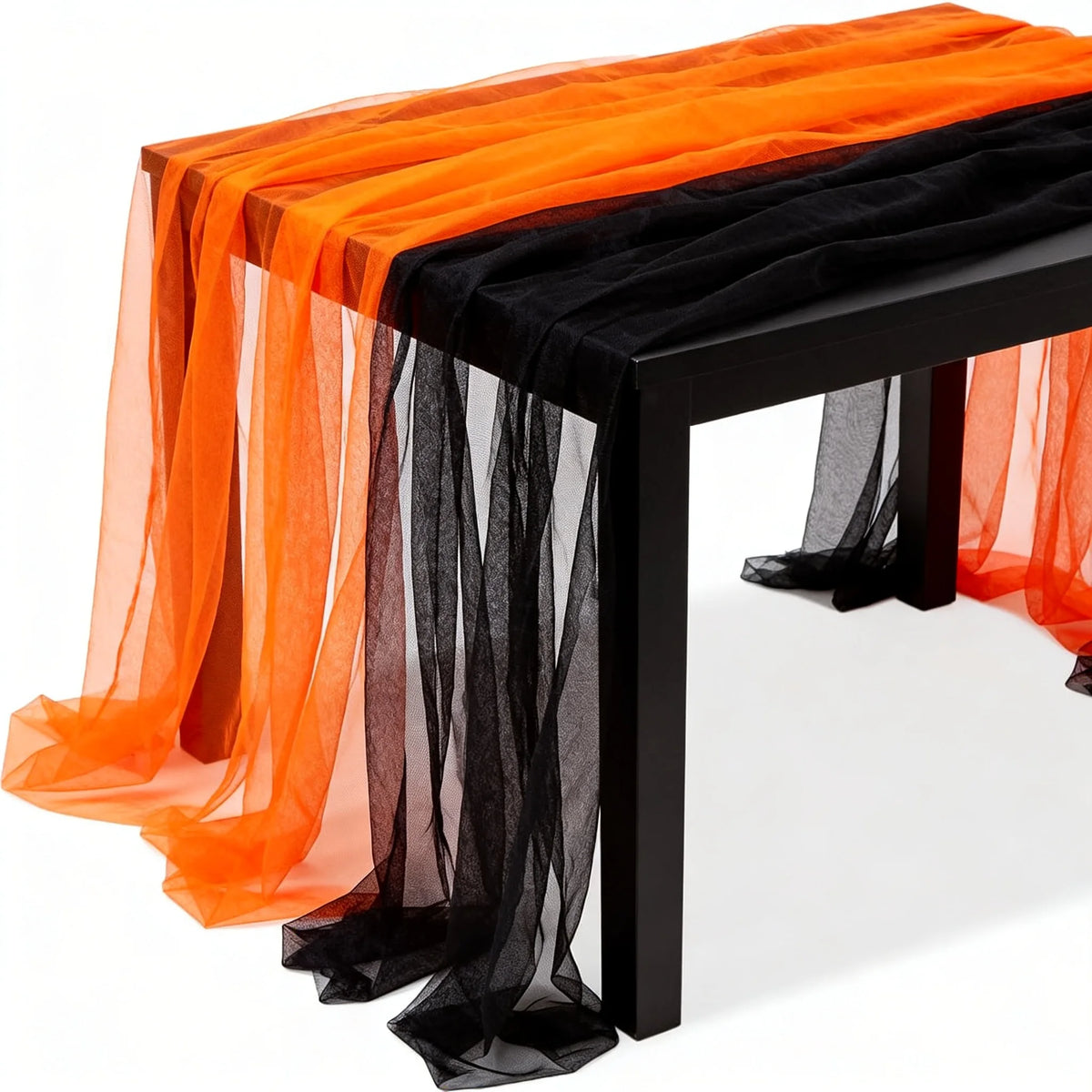 Vampnet orange and black sheer tulle fabric roll styled for a Halloween display