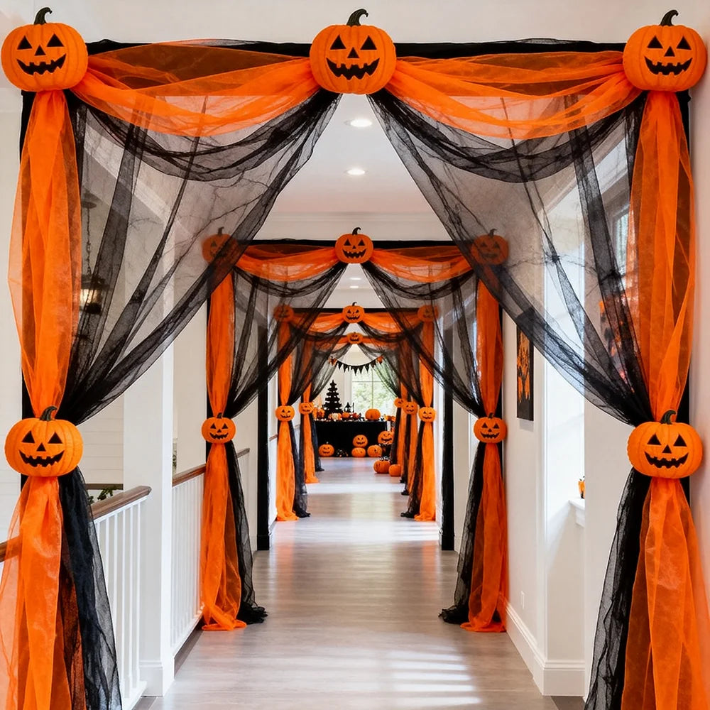 Vampnet orange and black tulle draped as a pumpkin-topped archway decoration down a hallway
