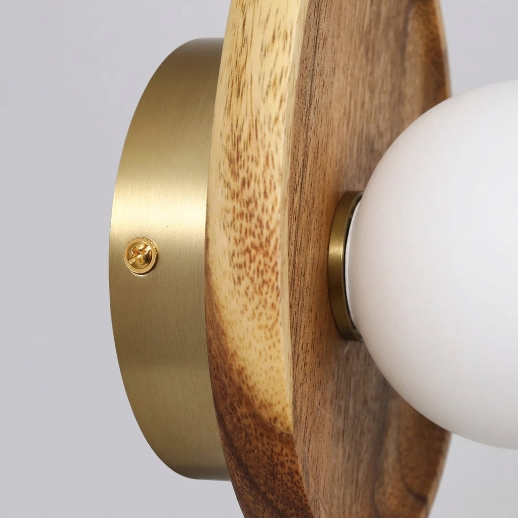 Vebza Japandi orb wall light close-up showing the mounting plate and wood edge