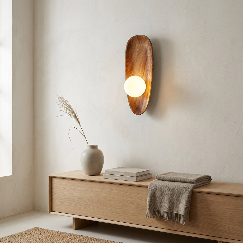 Vebza Japandi orb wall light, Type A, mounted above a console table in an entryway, lit