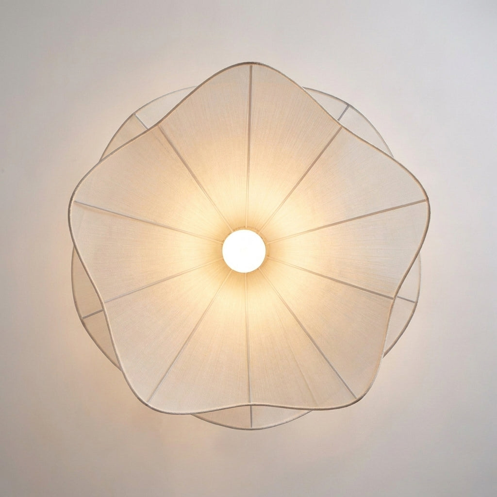 Close-up top-down view of Veqzu's radial pleated fabric shade and bulb