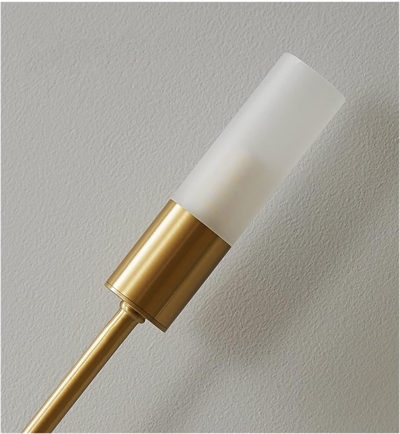 Close-up of the frosted acrylic cylindrical shade and gold hardware on the LED vergs wall sconce