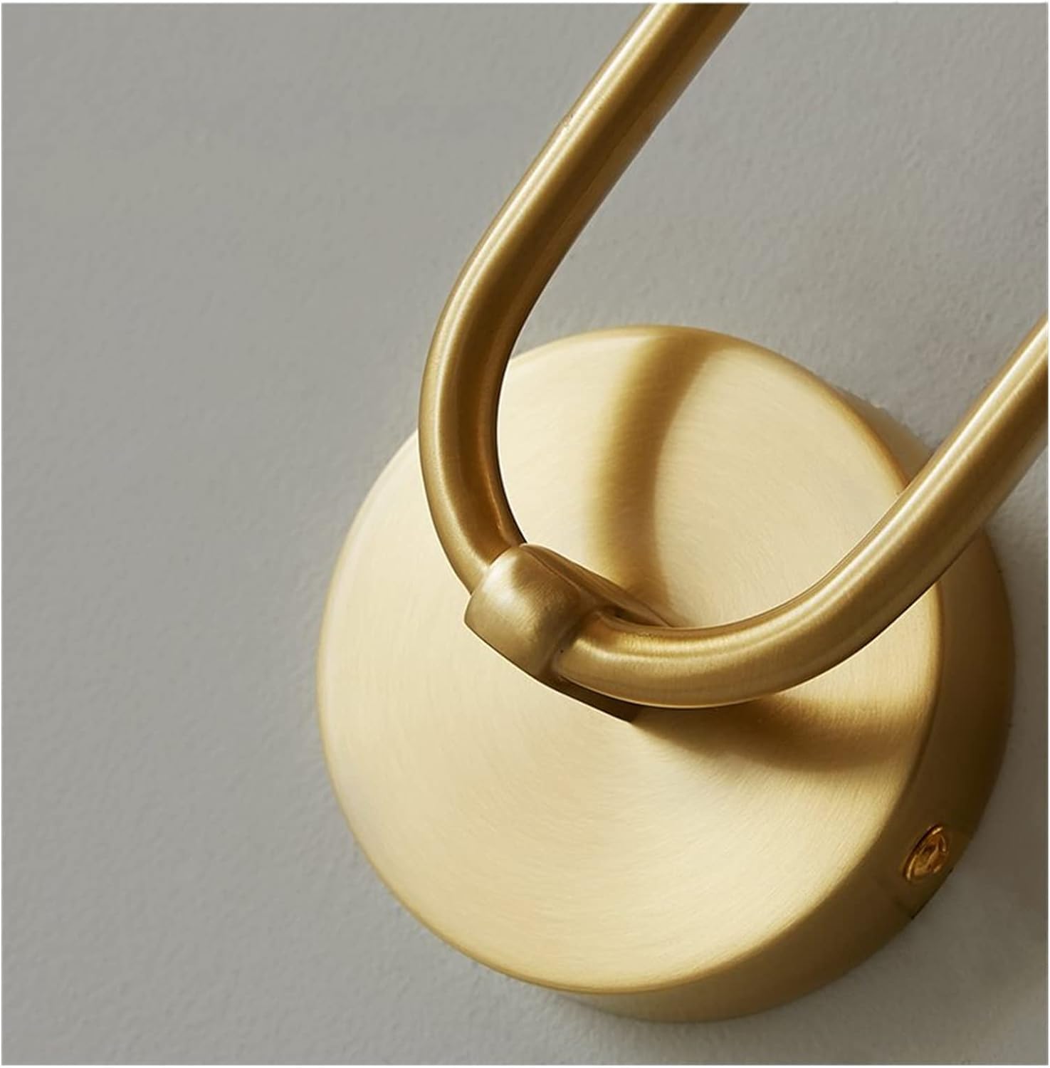 vergs close-up detail of the premium brushed gold wall canopy and U-shaped tubular joint