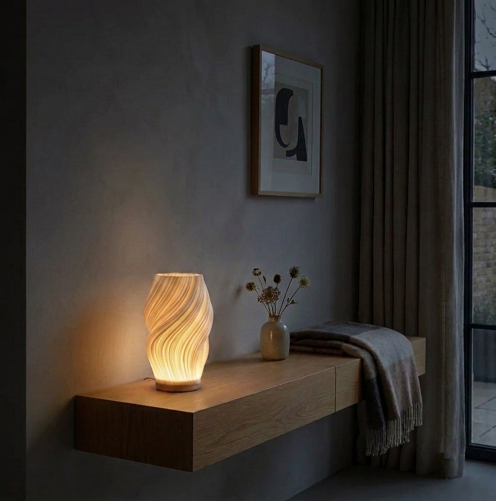Volzi cream 3D wave table lamp on a floating wood shelf in a living room