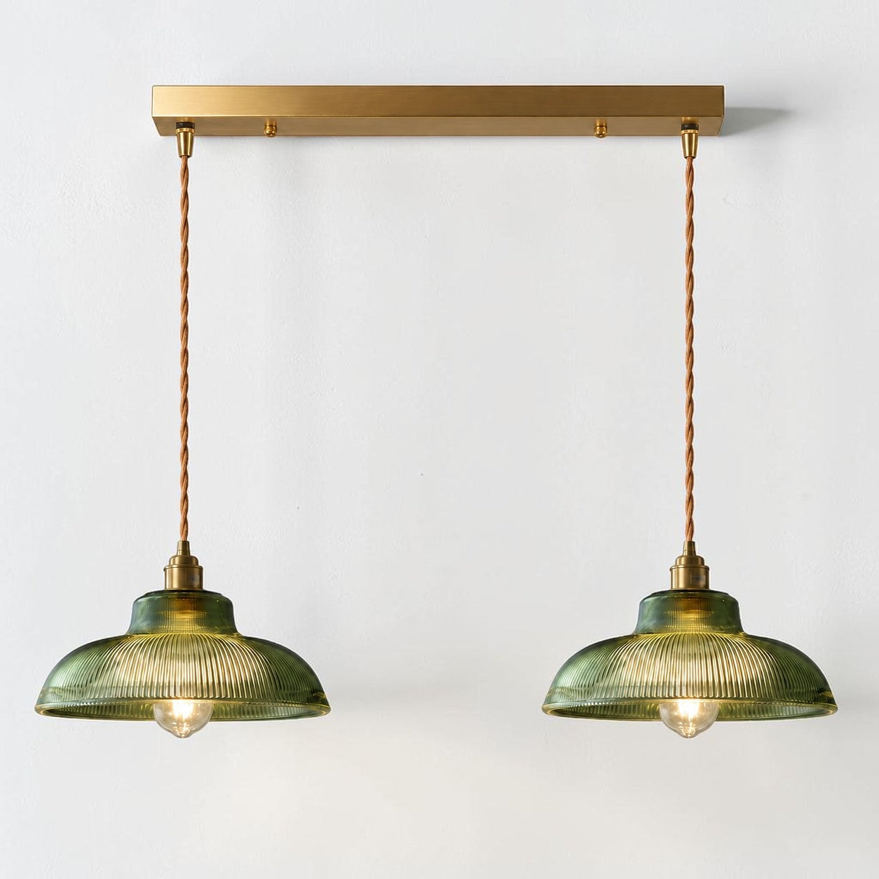 Vopzi 2-Light pendant fixture with brass base, alternate cord finish on a white background