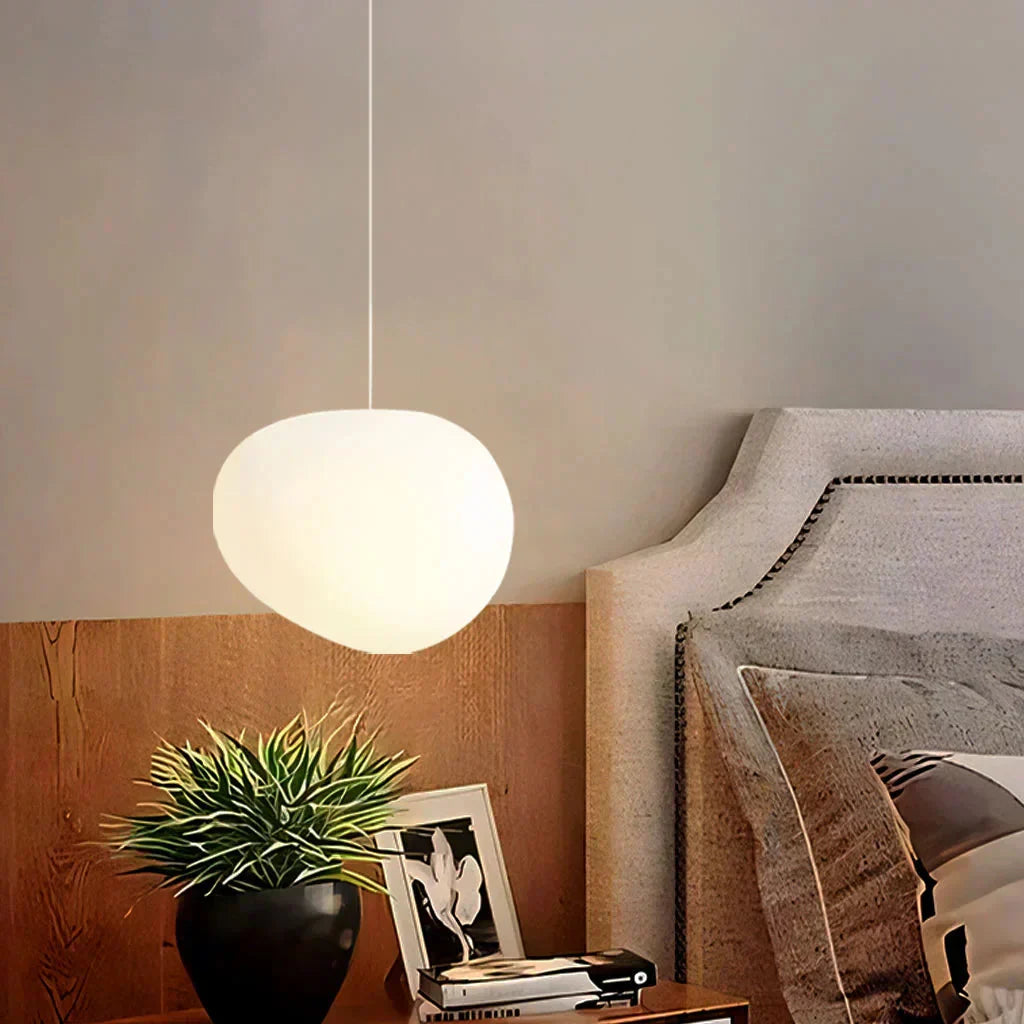 Wabi-Sabi glass pebble pendant light styled as an elegant bedside reading lamp