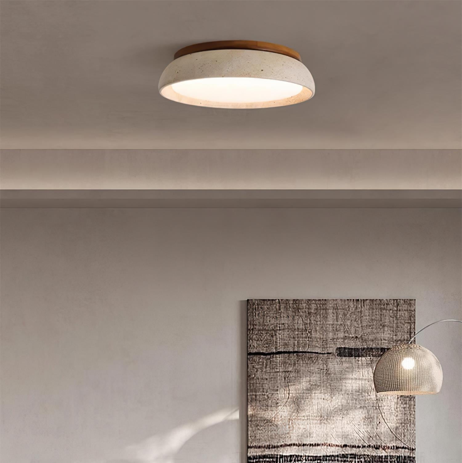 Wabi-Sabi stone ceiling light installed against a neutral textured wall