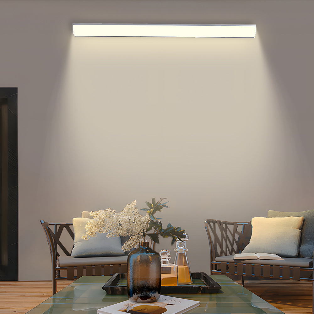 Waterproof LED linear sconce providing soft lighting for an outdoor lounge area
