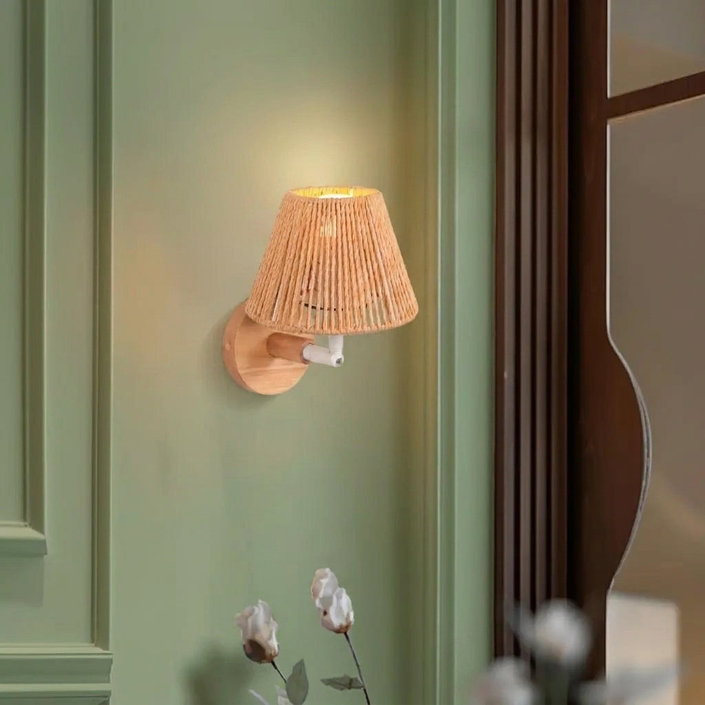 Welsi Japandi wabi-sabi wall sconce mounted on a sage green wall, hemp rope shade detail