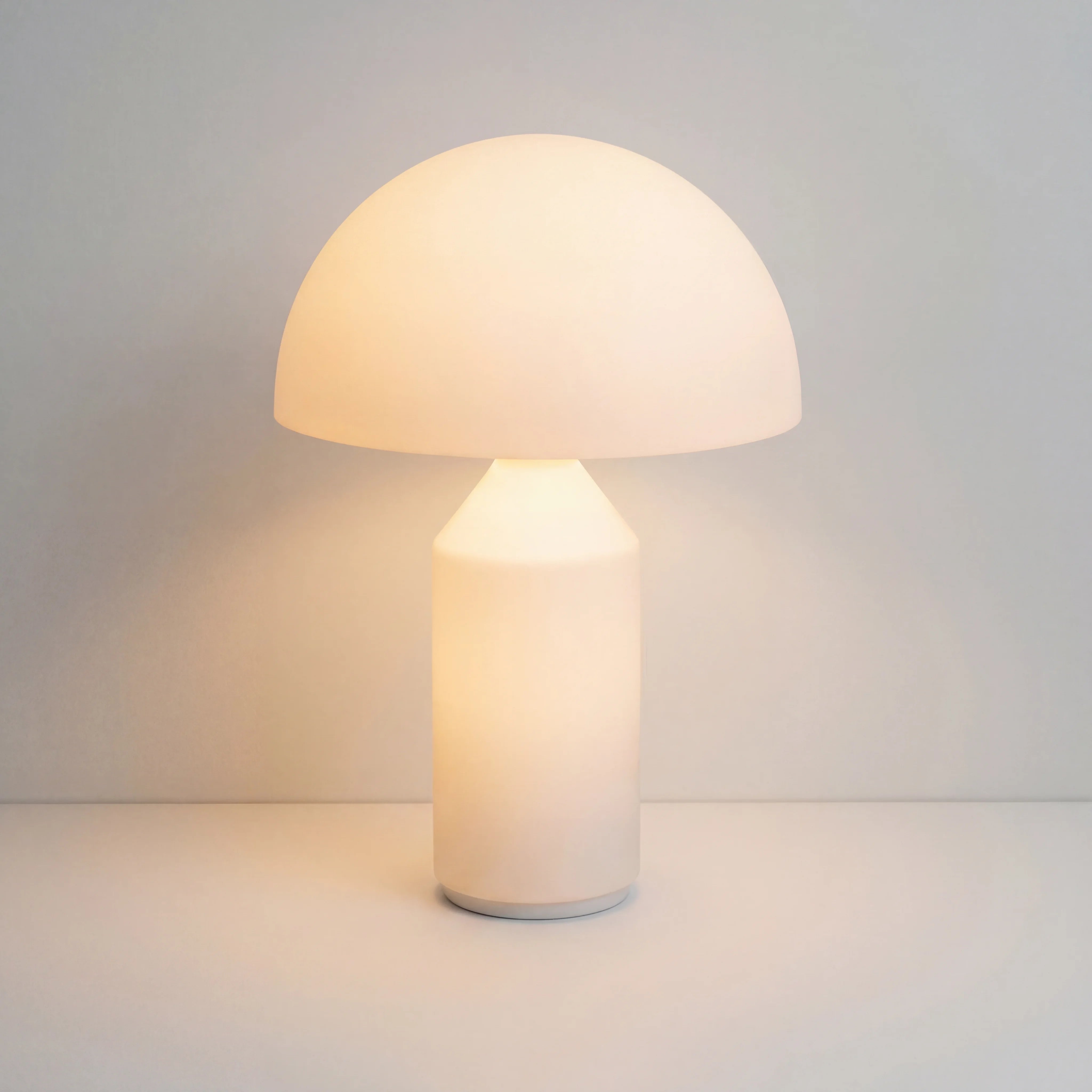 Illuminated wesk opal glass mushroom table lamp glowing softly from both the dome and base