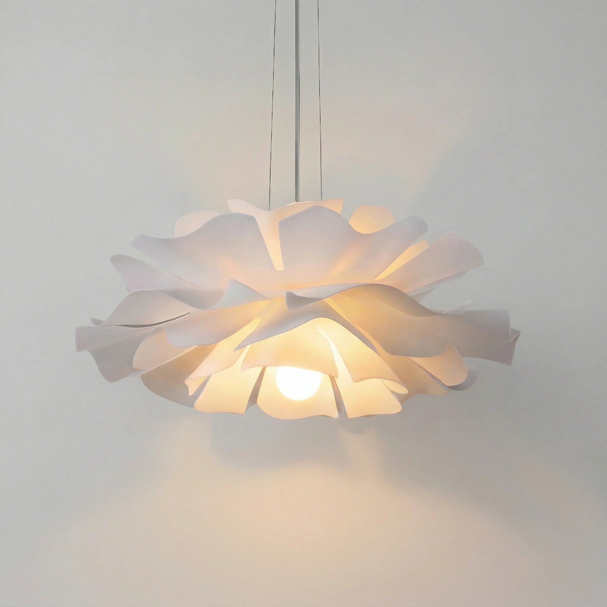 White acrylic floral chandelier showcasing its blooming lotus petal design