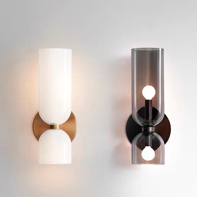 Side-by-side comparison of the opaque white and translucent grey double-head glass wall sconces