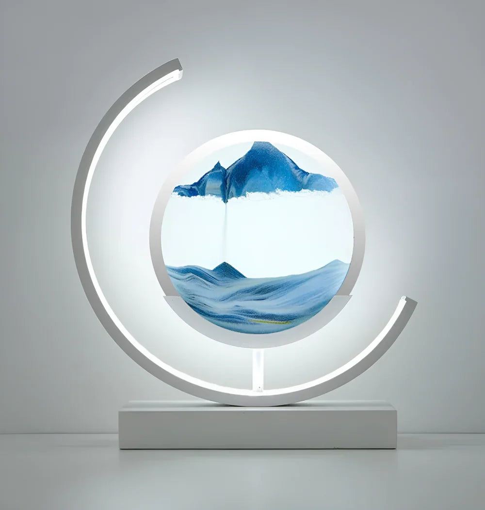 White kinetic sand desk light showcasing a calming blue oceanic sand landscape