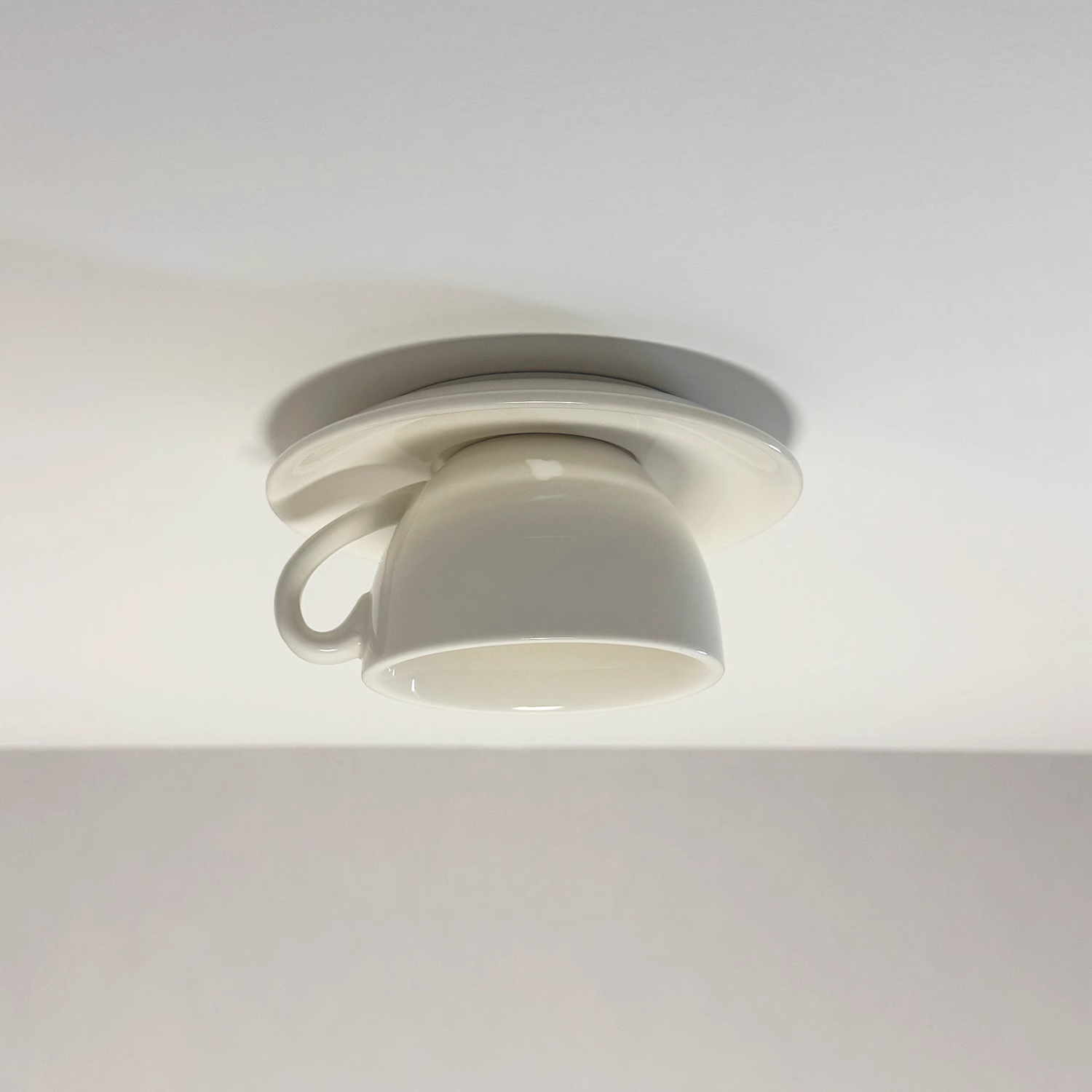 Clean white ceramic teacup flush mount light, perfect for a modern minimalist kitchen