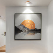 Modern white cylinder flush mount ceiling light highlighting wall artwork in a minimalist room