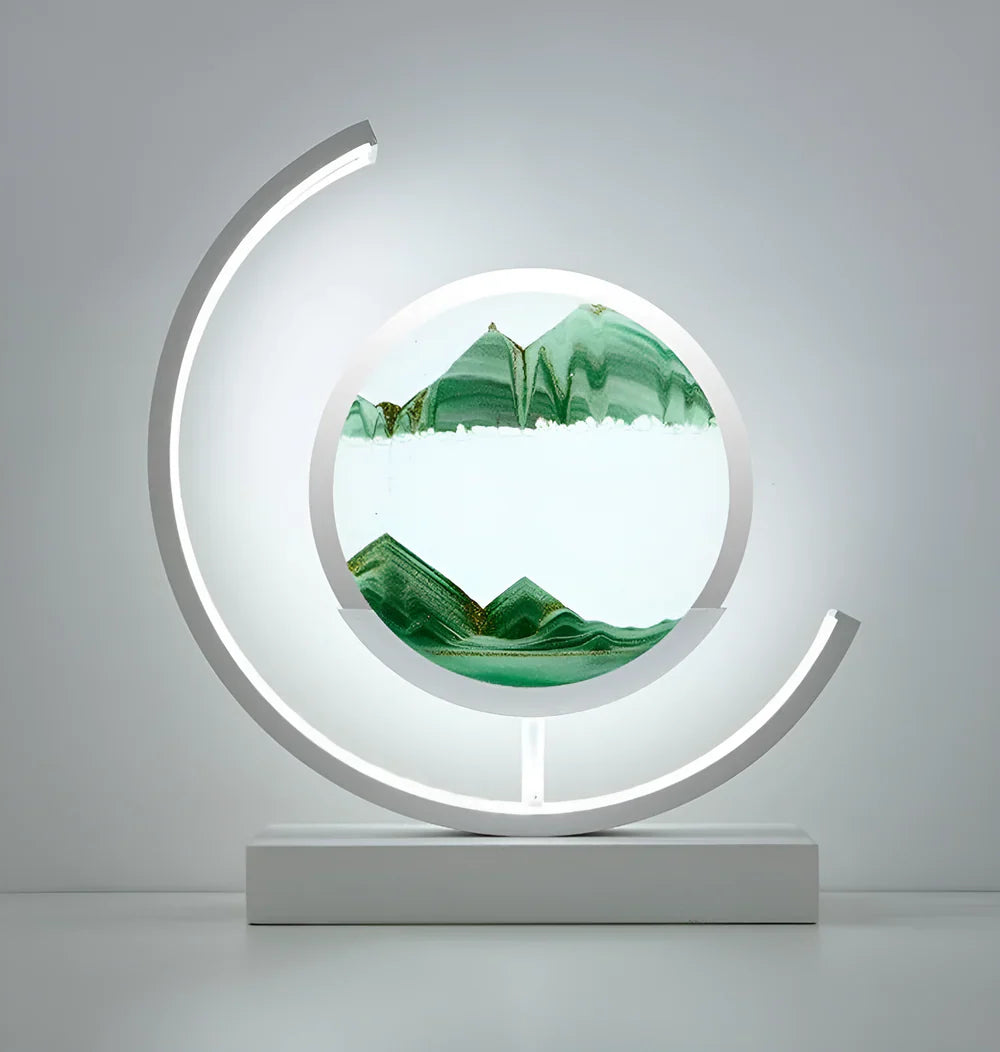 White moving sand art fixture with green falling sand isolated on a clean, light background