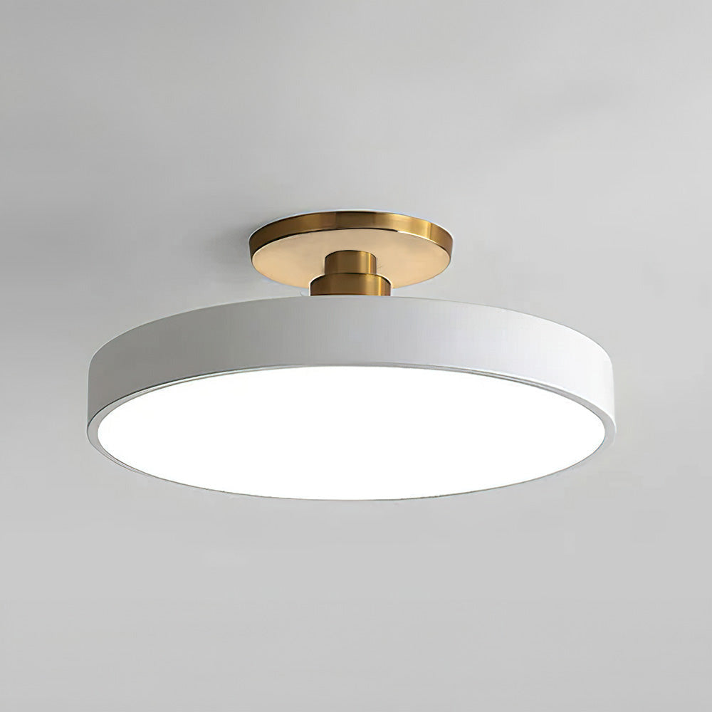 Clean white minimalist drum ceiling lamp isolated on a neutral background