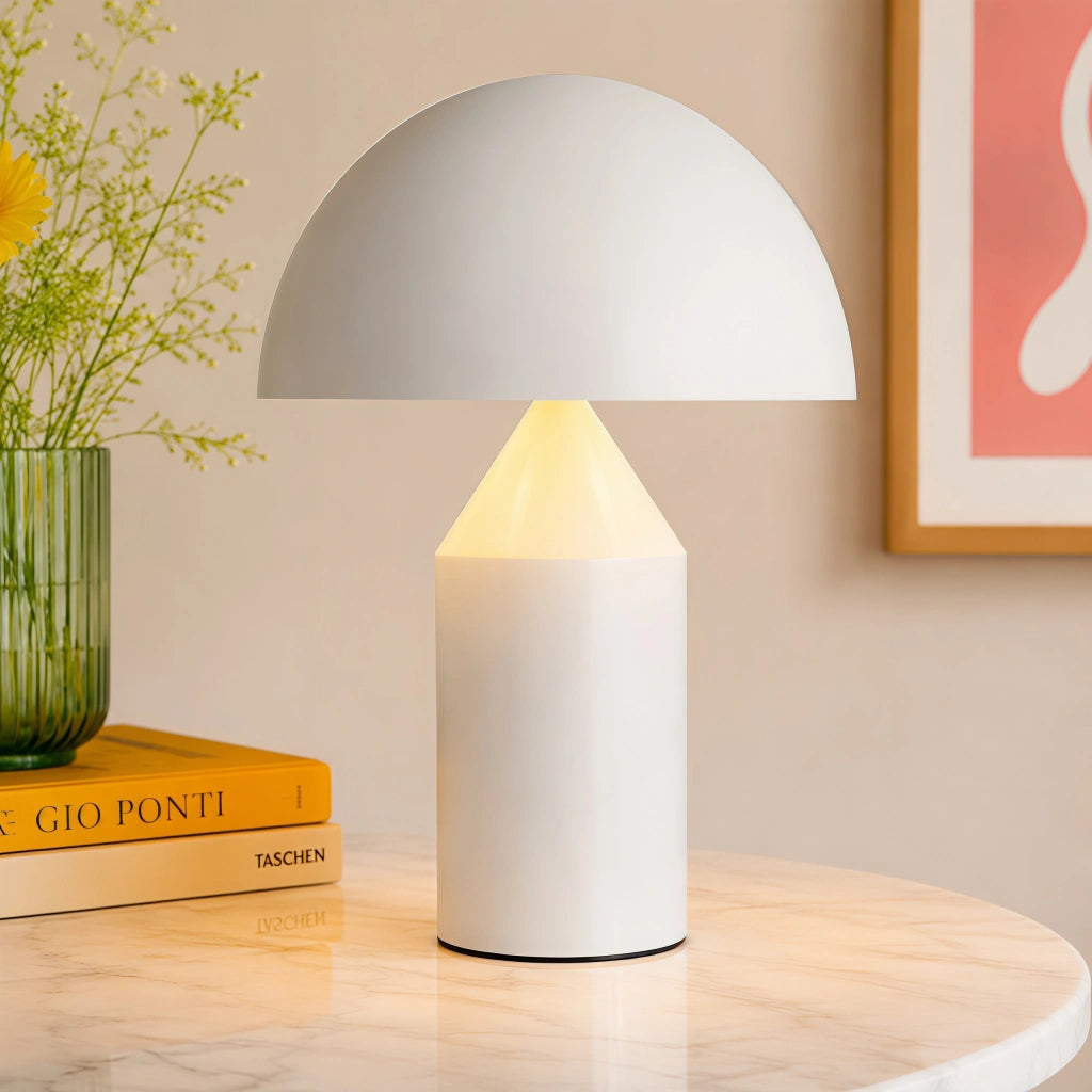 White mushroom lamp styled elegantly on a round marble table with a book and plant