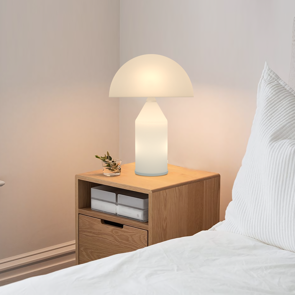White mushroom lamp providing glare-free illumination on a wooden bedside nightstand