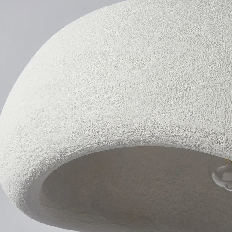 Close-up detail of the premium white resin texture on the asymmetrical pendant light