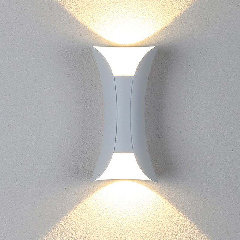White up and down exterior wall light casting a warm, cosy V-shaped glow
